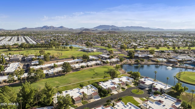 drone / aerial view with a water and mountain view