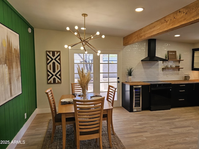 dining area with beam ceiling, a chandelier, beverage cooler, light wood-style flooring, and recessed lighting