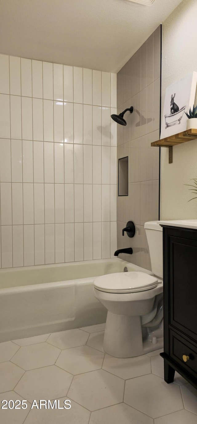 full bathroom featuring toilet, vanity, shower / bath combination, and tile patterned flooring