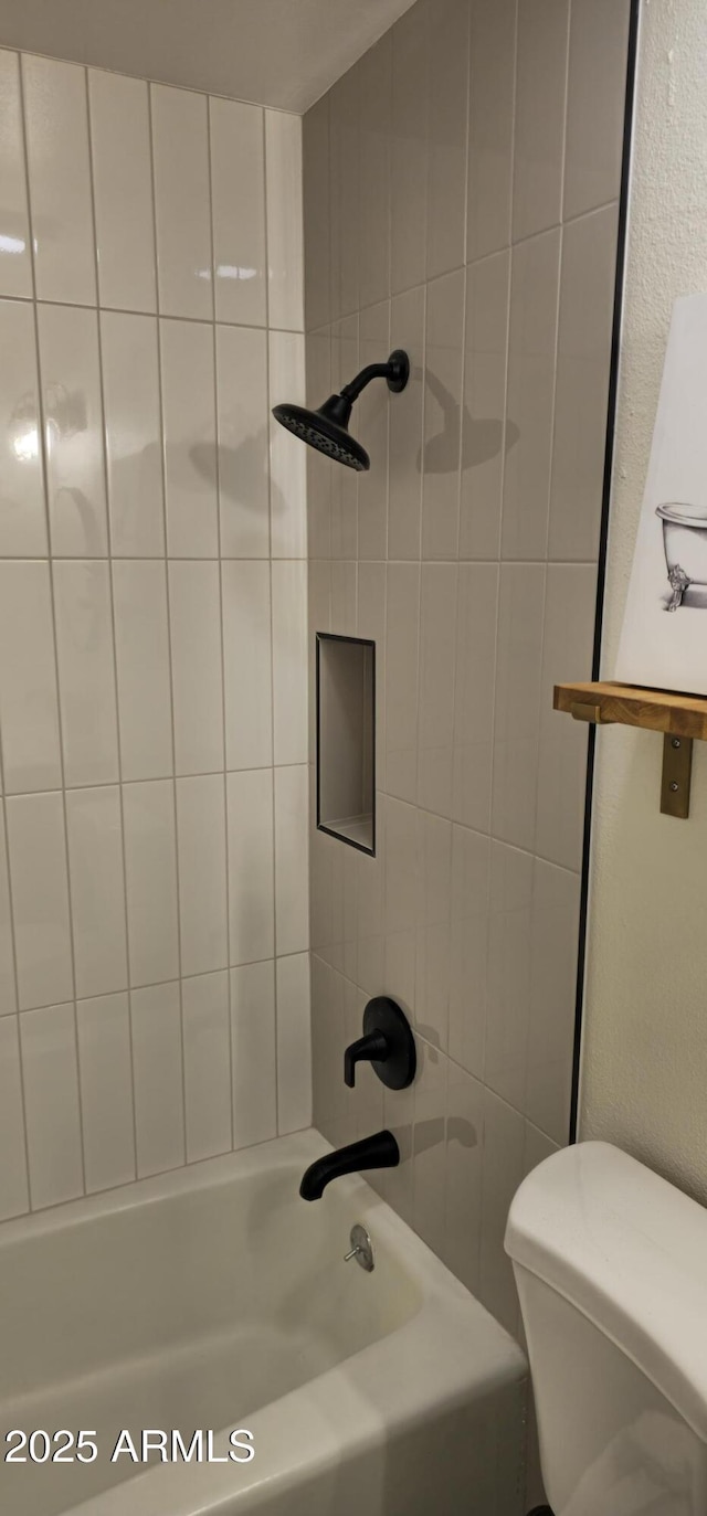 full bathroom featuring toilet and bathing tub / shower combination