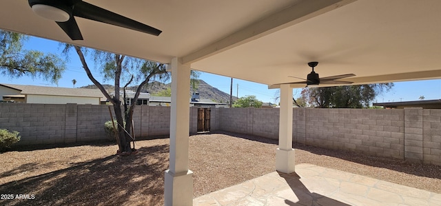 view of patio featuring a fenced backyard and a ceiling fan