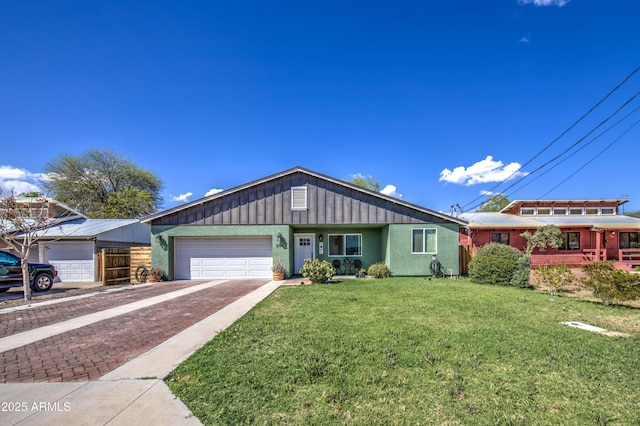 single story home featuring driveway, an attached garage, a front lawn, and board and batten siding