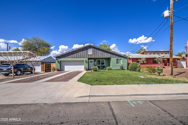 ranch-style house featuring board and batten siding, concrete driveway, a garage, and a front lawn