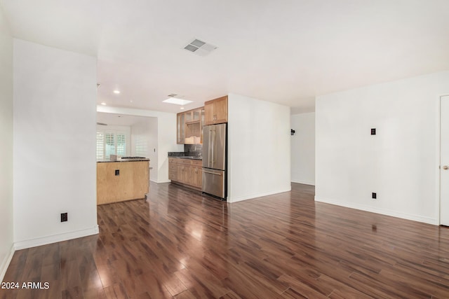 unfurnished living room with dark hardwood / wood-style floors