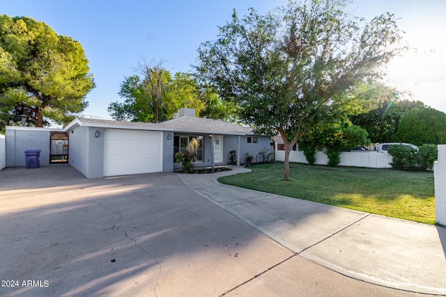 single story home with a front lawn and a garage