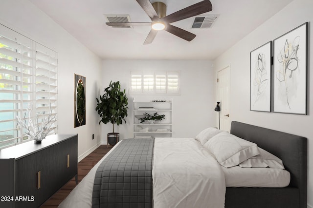 bedroom featuring ceiling fan and dark hardwood / wood-style flooring