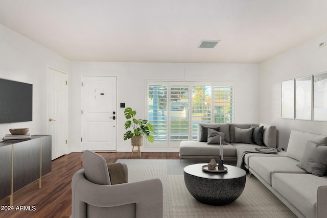 living room with dark hardwood / wood-style flooring