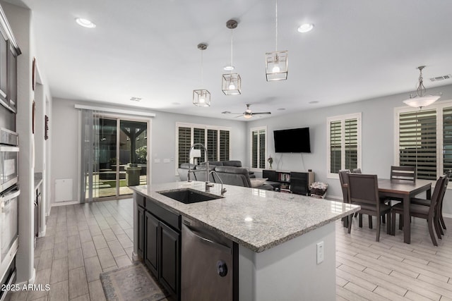 kitchen featuring visible vents, appliances with stainless steel finishes, pendant lighting, and wood finish floors