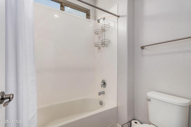 full bath with shower / tub combo and toilet