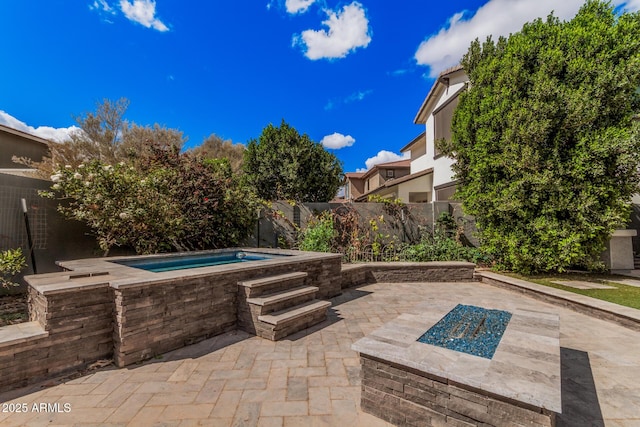 view of pool featuring a fenced backyard, an outdoor hot tub, and a patio