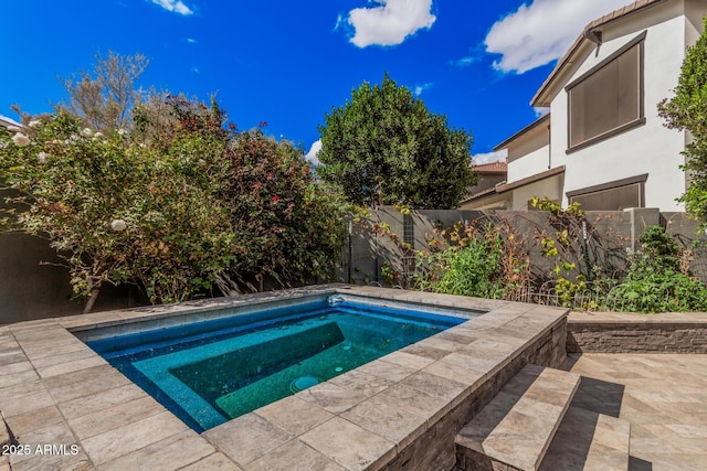 view of pool with a patio area and a fenced backyard