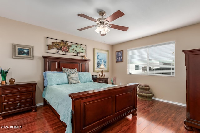 bedroom featuring ceiling fan and dark hardwood / wood-style flooring