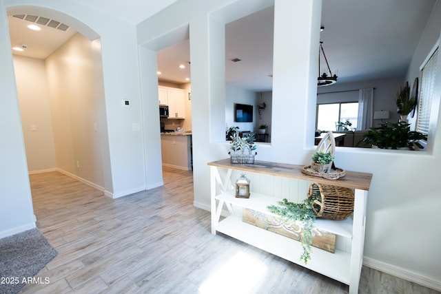 1364 W Spine Tree Ave, Queen Creek, AZ 85140 - hall with arched walkways, light wood-type flooring, baseboards, and recessed lighting