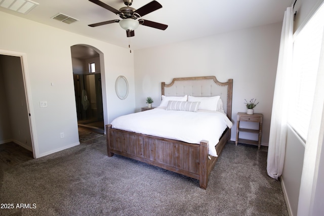 1364 W Spine Tree Ave, Queen Creek, AZ 85140 - bedroom with arched walkways, carpet flooring, baseboards, a ceiling fan, and connected bathroom