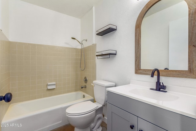 full bathroom featuring vanity, toilet, and tiled shower / bath