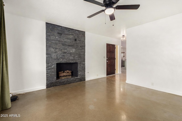 unfurnished living room with ceiling fan and a fireplace