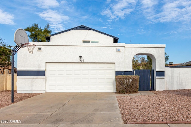 view of front of home featuring basketball court