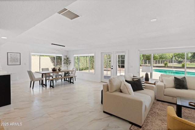 1509 W Kiowa Ave, Mesa, AZ 85202 - living room featuring french doors, light marble finish floors, and recessed lighting