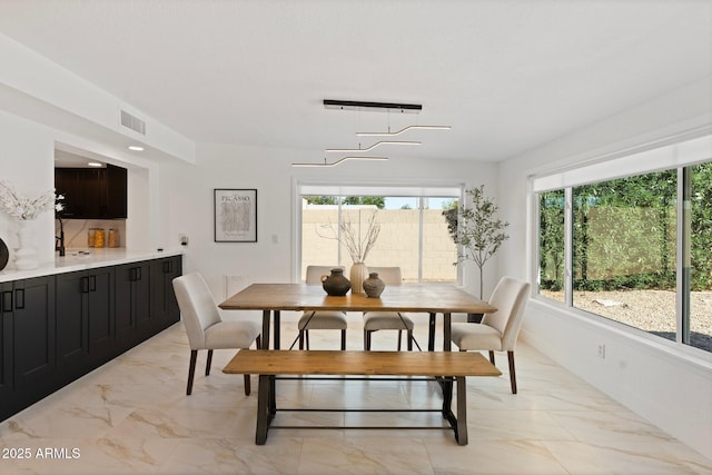 1509 W Kiowa Ave, Mesa, AZ 85202 - dining area featuring light marble finish flooring and baseboards