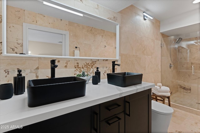1509 W Kiowa Ave, Mesa, AZ 85202 - full bathroom with tile walls, a shower stall, tasteful backsplash, and double vanity