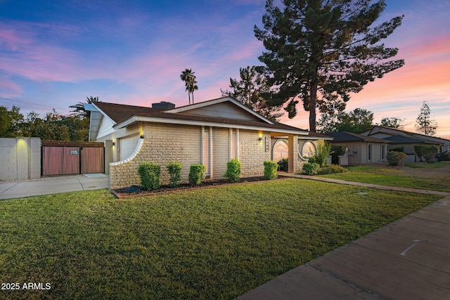 1509 W Kiowa Ave, Mesa, AZ 85202 - ranch-style home featuring concrete driveway, an attached garage, and a gate