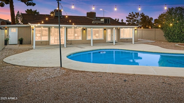 1509 W Kiowa Ave, Mesa, AZ 85202 - pool at dusk featuring a patio
