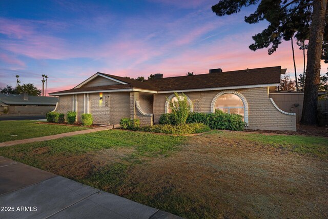 1509 W Kiowa Ave, Mesa, AZ 85202 - ranch-style house featuring a lawn and brick siding