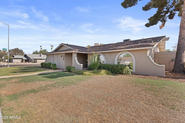 1509 W Kiowa Ave, Mesa, AZ 85202 - single story home with brick siding, a front lawn, and a chimney