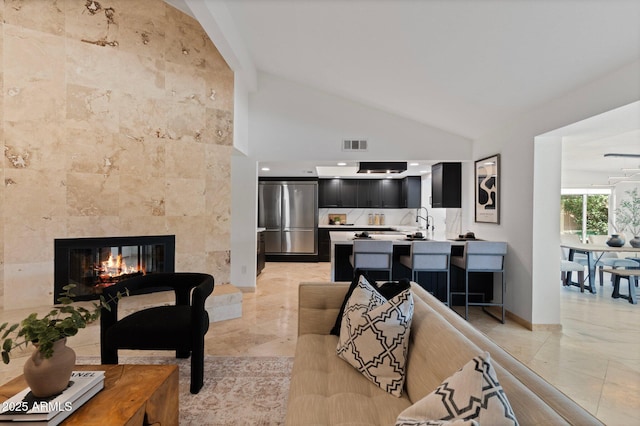1509 W Kiowa Ave, Mesa, AZ 85202 - living area featuring lofted ceiling and a tiled fireplace