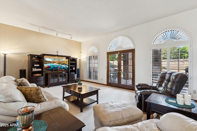 6208 E Paradise Ln, Scottsdale, AZ 85254 - living room with french doors and light carpet