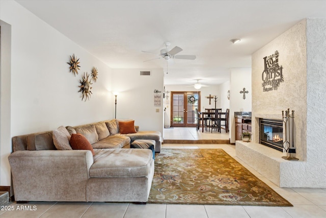 6208 E Paradise Ln, Scottsdale, AZ 85254 - tiled living area featuring visible vents, ceiling fan, and a high end fireplace
