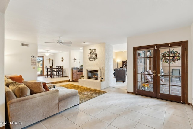 6208 E Paradise Ln, Scottsdale, AZ 85254 - living area featuring light tile patterned floors, visible vents, a ceiling fan, and french doors