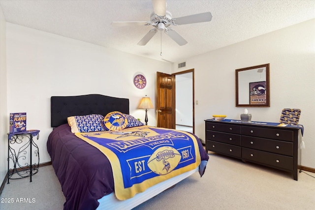 6208 E Paradise Ln, Scottsdale, AZ 85254 - bedroom featuring visible vents, baseboards, ceiling fan, carpet, and a textured ceiling