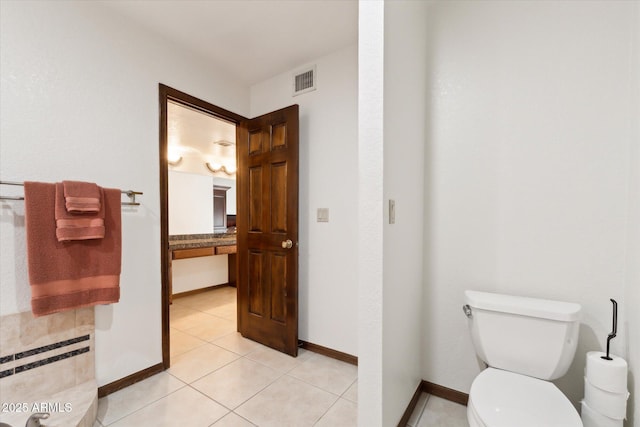 6208 E Paradise Ln, Scottsdale, AZ 85254 - bathroom with toilet, visible vents, tile patterned floors, and baseboards