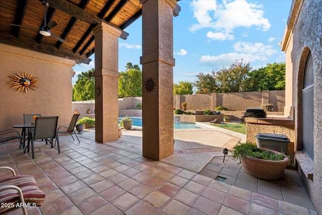 6208 E Paradise Ln, Scottsdale, AZ 85254 - view of patio / terrace featuring exterior kitchen, a fenced in pool, outdoor dining space, a fenced backyard, and ceiling fan