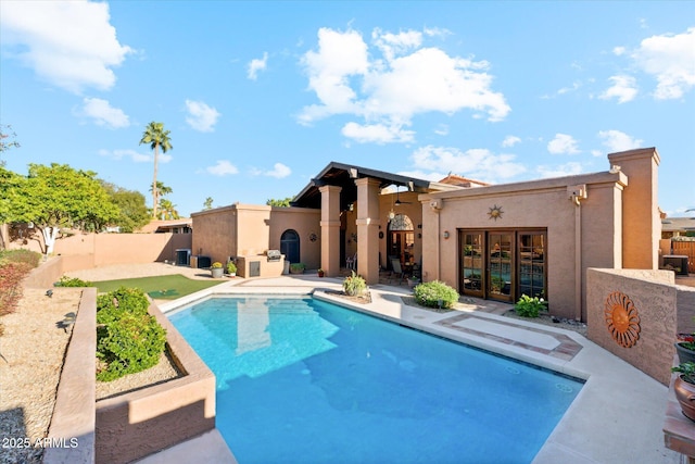 6208 E Paradise Ln, Scottsdale, AZ 85254 - view of swimming pool with french doors, a fenced backyard, a fenced in pool, and a patio