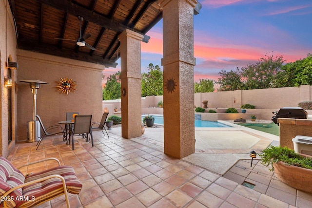 6208 E Paradise Ln, Scottsdale, AZ 85254 - view of patio / terrace with ceiling fan, a grill, a fenced backyard, a fenced in pool, and outdoor dining area