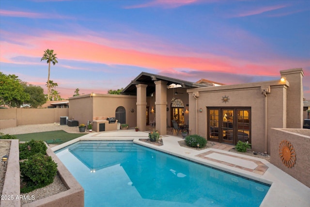 6208 E Paradise Ln, Scottsdale, AZ 85254 - view of pool with a fenced in pool, exterior kitchen, french doors, a patio area, and a fenced backyard