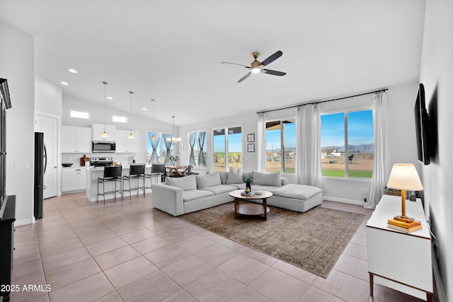 28435 N 249th Ln, Wittmann, AZ 85361 - living area with vaulted ceiling, a ceiling fan, light tile patterned flooring, baseboards, and recessed lighting