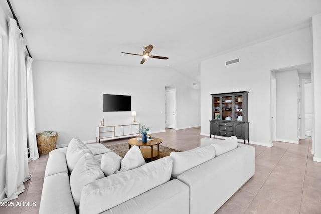 28435 N 249th Ln, Wittmann, AZ 85361 - living room featuring a ceiling fan, lofted ceiling, light tile patterned flooring, and baseboards