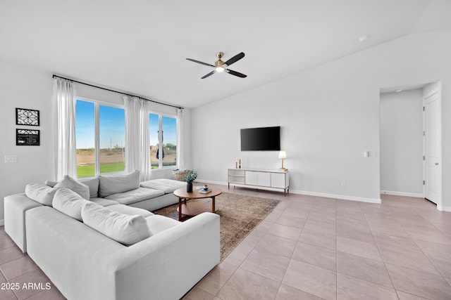 28435 N 249th Ln, Wittmann, AZ 85361 - living area featuring lofted ceiling, ceiling fan, light tile patterned floors, and baseboards