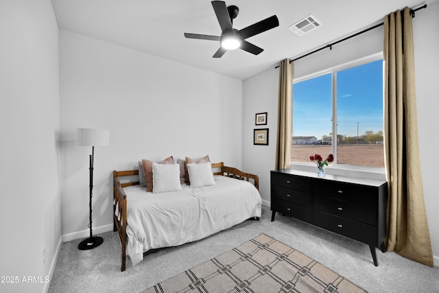 28435 N 249th Ln, Wittmann, AZ 85361 - bedroom featuring light colored carpet, baseboards, and a ceiling fan