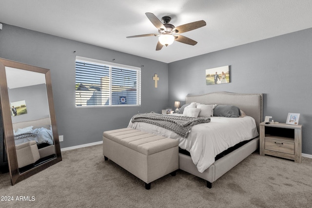 bedroom featuring ceiling fan and light colored carpet