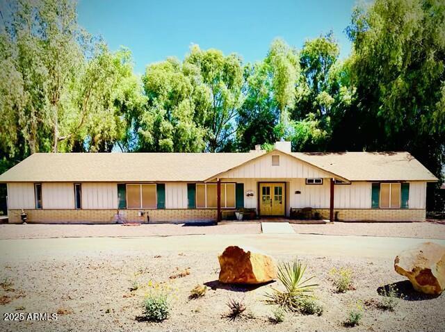 19024 E Cloud Rd, Queen Creek, AZ 85142 - ranch-style home with brick siding, french doors, and board and batten siding