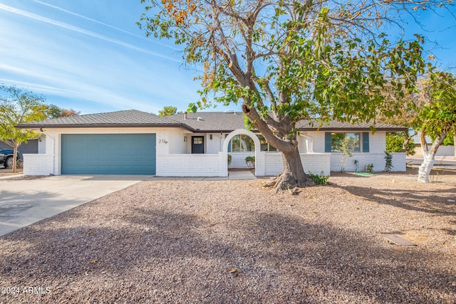 ranch-style house featuring a garage