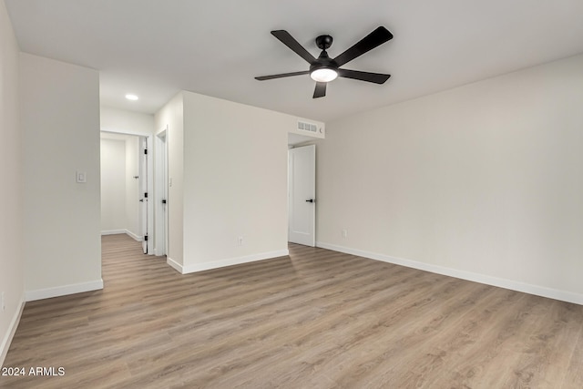 unfurnished room with ceiling fan and light hardwood / wood-style flooring