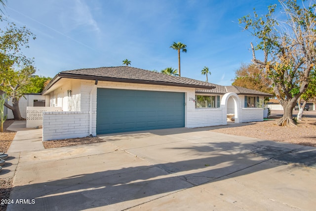 ranch-style house featuring a garage