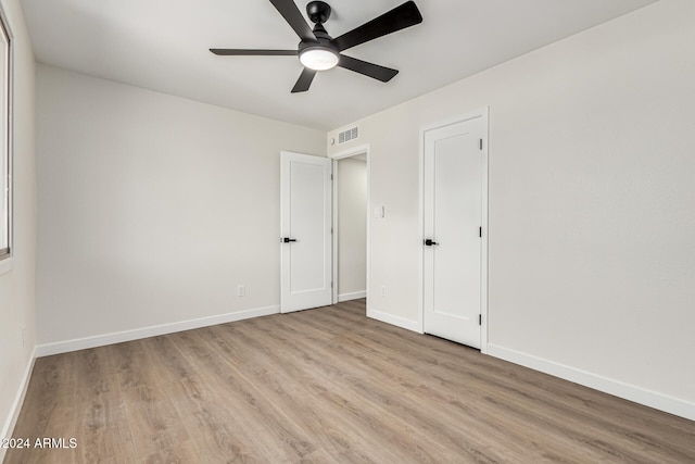 unfurnished bedroom featuring ceiling fan and light wood-type flooring