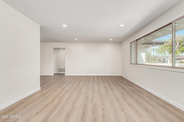 spare room with light hardwood / wood-style floors