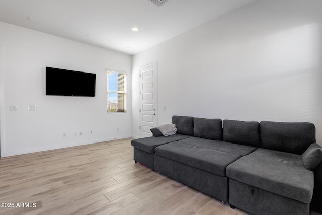 3885 E Kenley Ln, San Tan Valley, AZ 85143 - living room featuring light wood-style flooring and baseboards